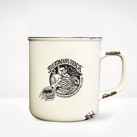 Deadman's Reach® coffee Camp Mug front view featuring skeleton art in black and white with words Deadman's Reach® and Raven's Brew Coffee®.