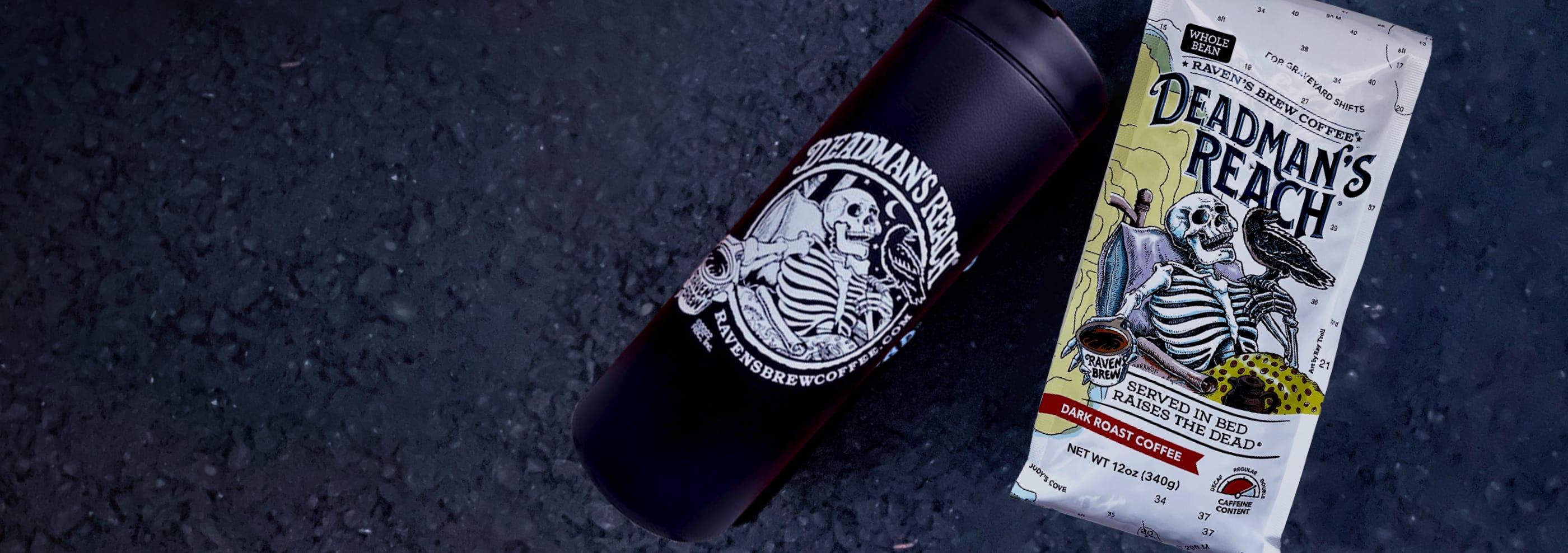 Package of Deadman's Reach Coffee and the Deadman's Reach Coffee Travel Mug laying on a asphalt road.