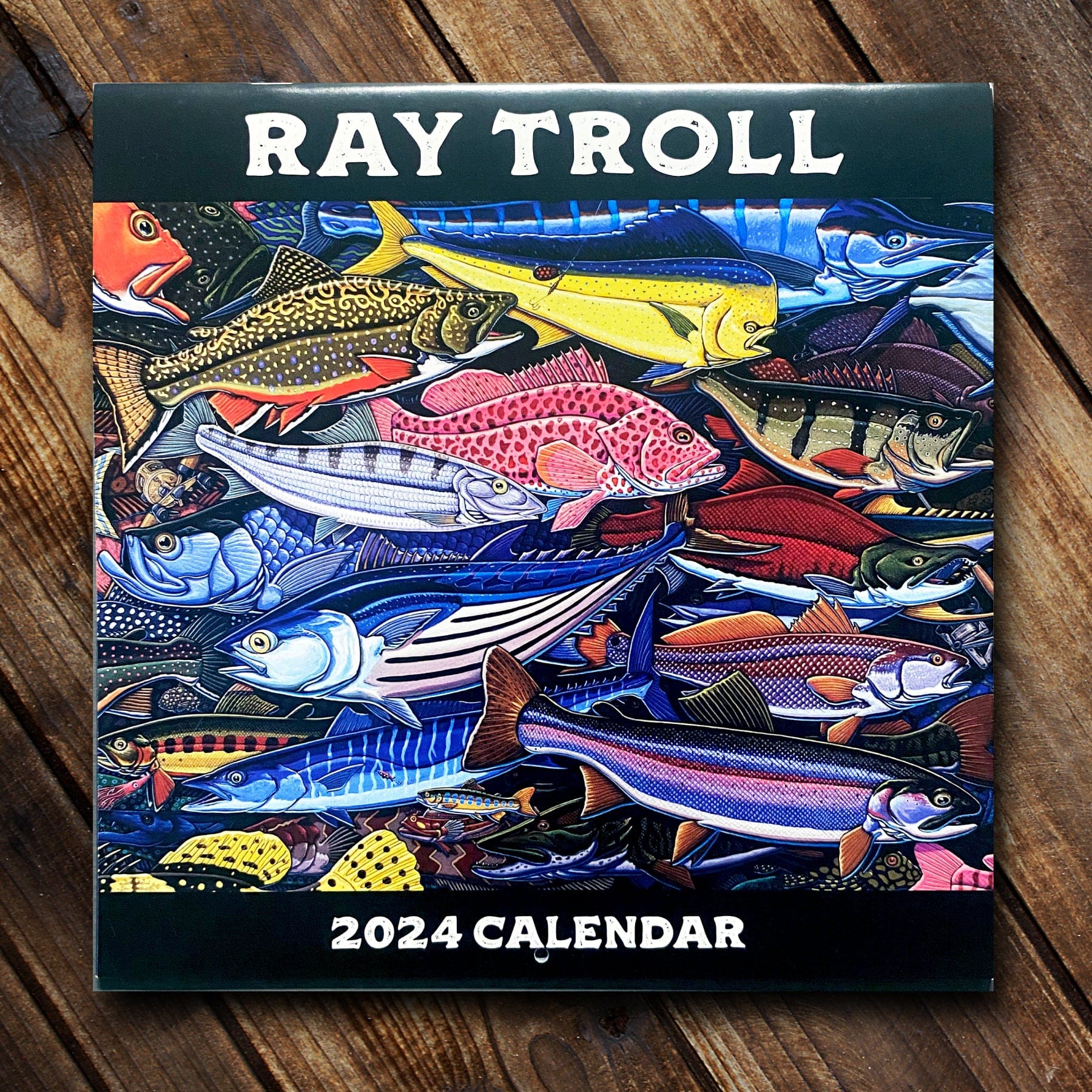 2024 12-Month Ray Troll Calendar: cover pictured shows a close up of a colorful assortment of fish illustrated in Ray Troll's unique style.