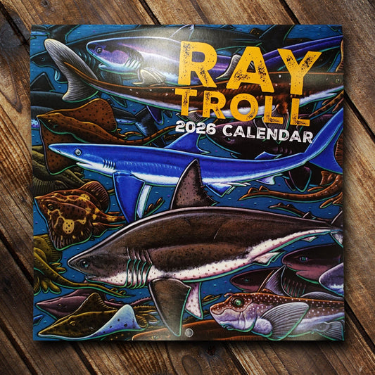 2026 Ray Troll calendar with illustrations of sharks and other fish in the blue ocean.