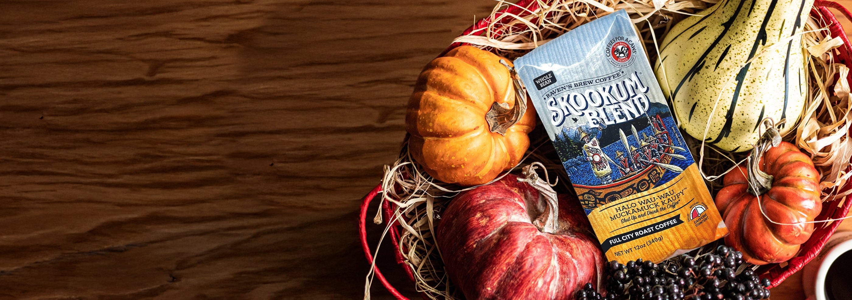 Basket with pumpkins and gourds featuring a bag of Skookum Blend Coffee.