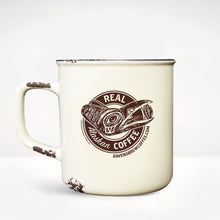 Alaskan Original Camp Mug back view featuring a ravens head in a stylized northwest coastal art style with the words Real Alaskan Coffee and the Raven's Brew Coffee website URL.