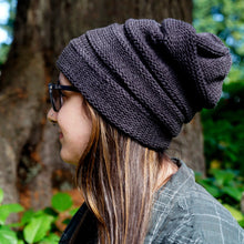 Beanie on body shot profile view on a woman.